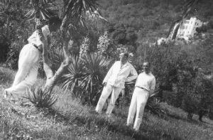 Vertov and companions under palm trees